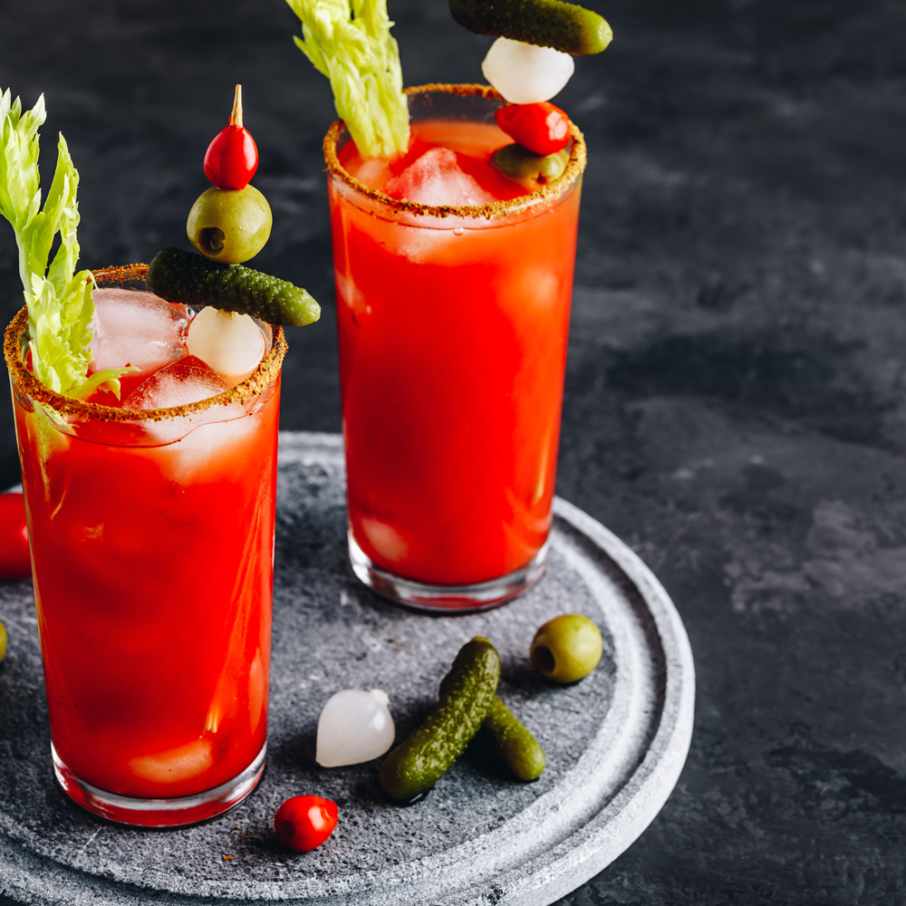 https://www.summertonclub.com/wp-content/uploads/2022/03/bloody-mary-cocktail-in-glasses-with-garnishes-2021-08-28-07-19-46-utc-1.png